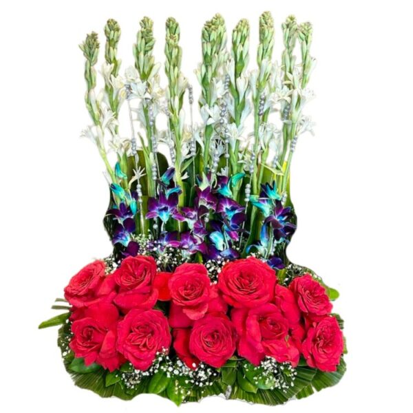 A Designer Arrangement of Red Roses, Blue Orchids & Fragrant Rajnigandhas